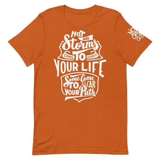 Inspirational t-shirt design with hand-lettered text, "Not all storms come to disrupt your life; some come to clear your path," symbolizing resilience and growth...orange