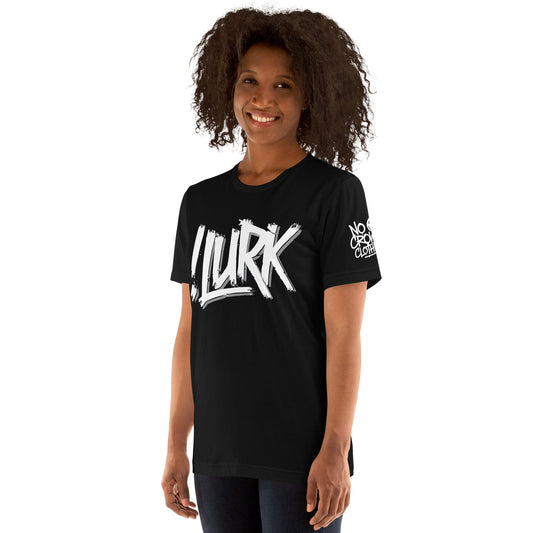 A black t-shirt featuring the bold text "!LURK" in edgy typography, designed for introverts and those who prefer a low-key, stylish look....left