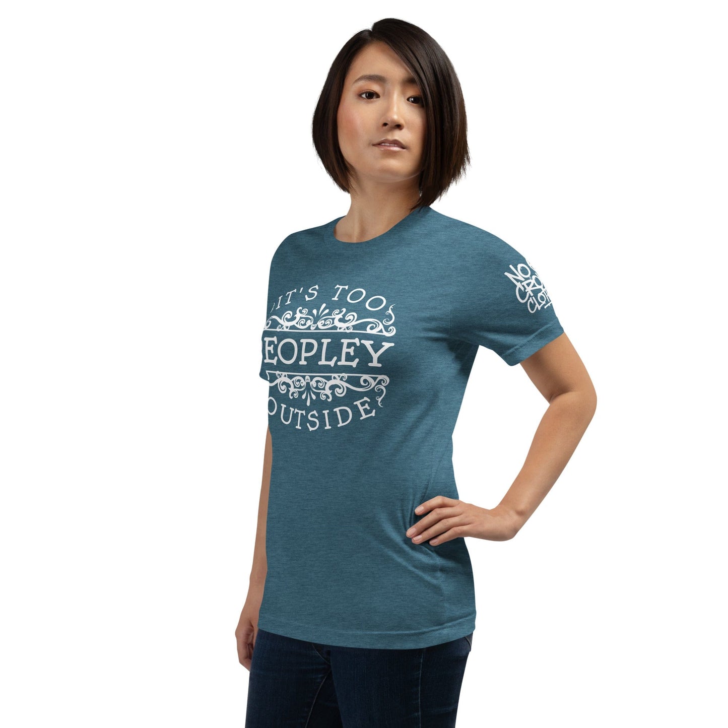 The 'It’s Too Peopley' t-shirt from No Crowd Clothing features bold typography and a minimalist design, perfect for those with social anxiety. Express your need for space and use humor to lighten overwhelming situations....teal model.