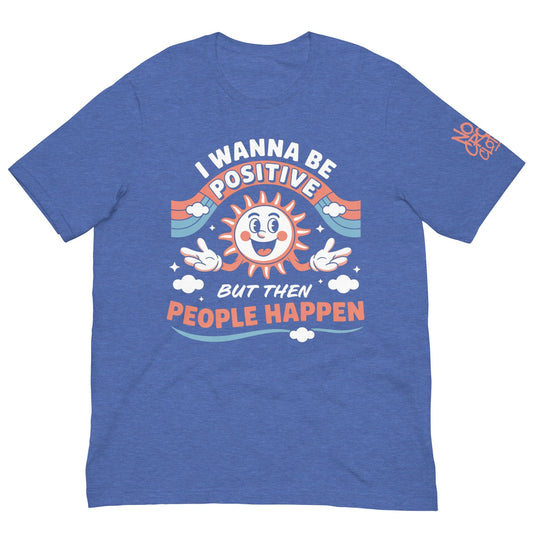 Blue t-shirt with a retro smiling sun design and the funny phrase “I Wanna Be Positive But Then People Happen,” featuring vintage-style colors and clouds.