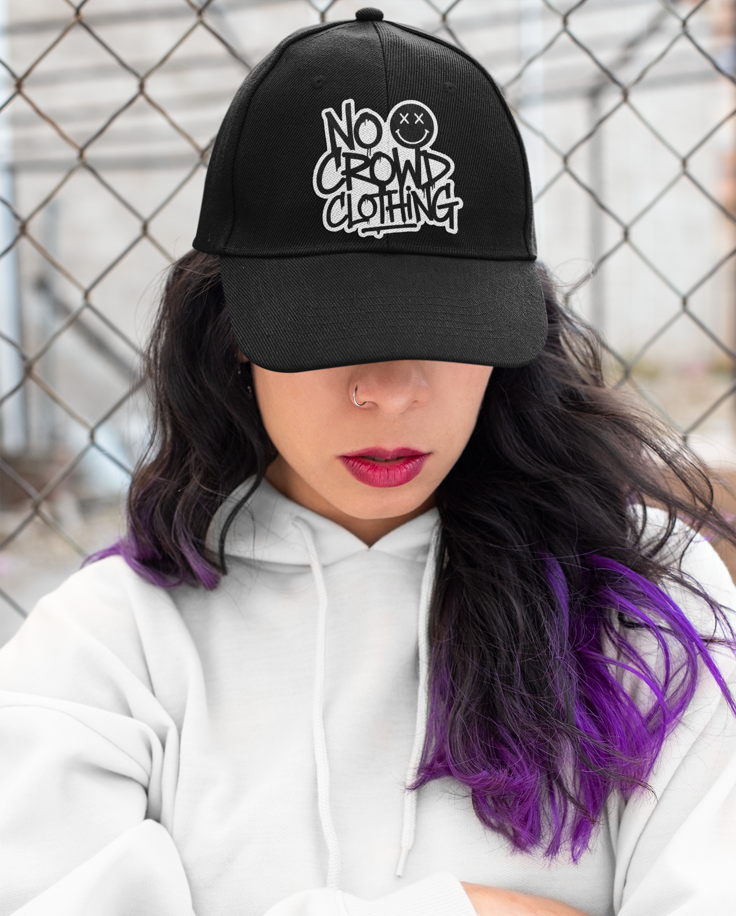 No Crowd Clothing’s hats collection features humorous, relatable designs about social anxiety with witty phrases like 'Lone Wolf' and 'Not Great at Small Talk,' offering stylish ways to express and embrace anxiety.