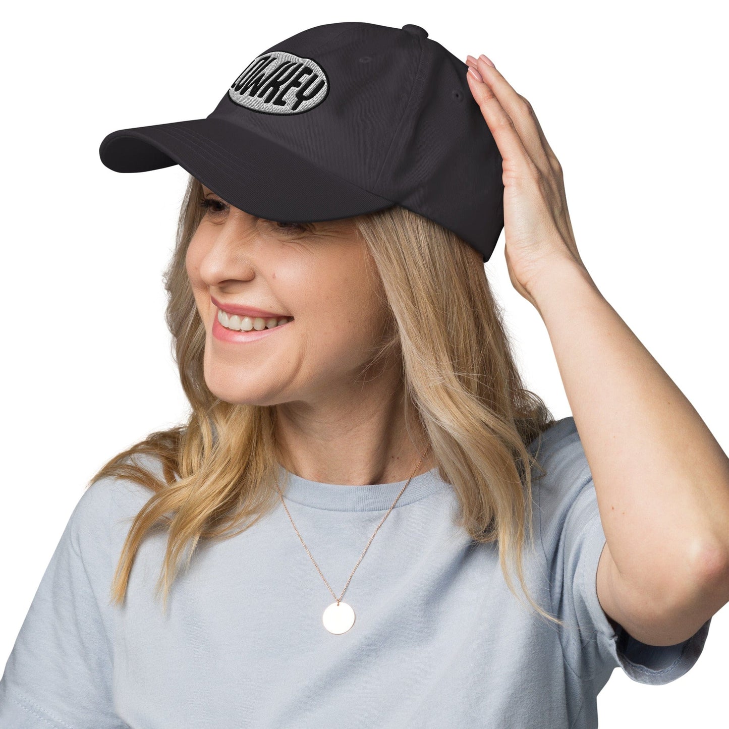 LOWKEY embroidered dad hat by No Crowd Clothing with a relaxed unstructured fit, minimal front text, and washed fabric for a clean, low-profile introvert style.....gray model