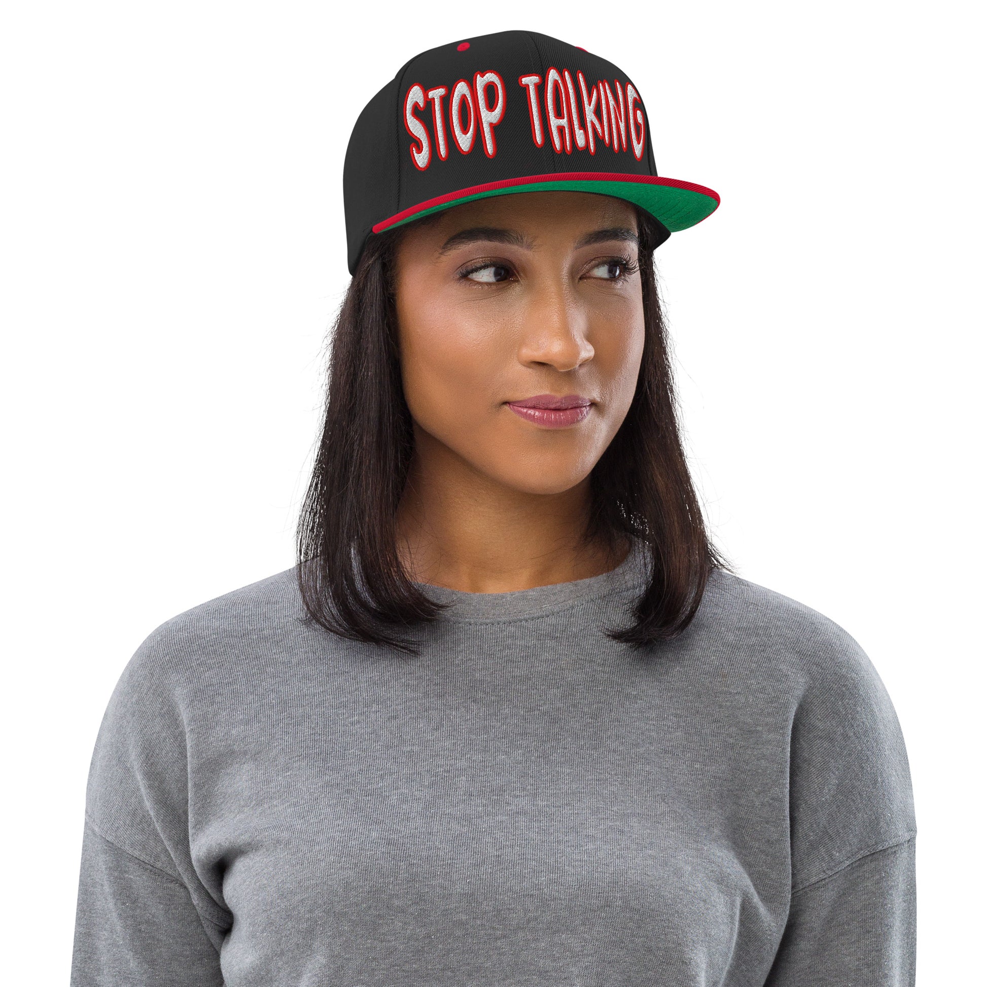 Black and red snapback hat with bold white and red embroidered “Stop Talking” text on the front, flat red brim, and structured crown, shown on a black background....female