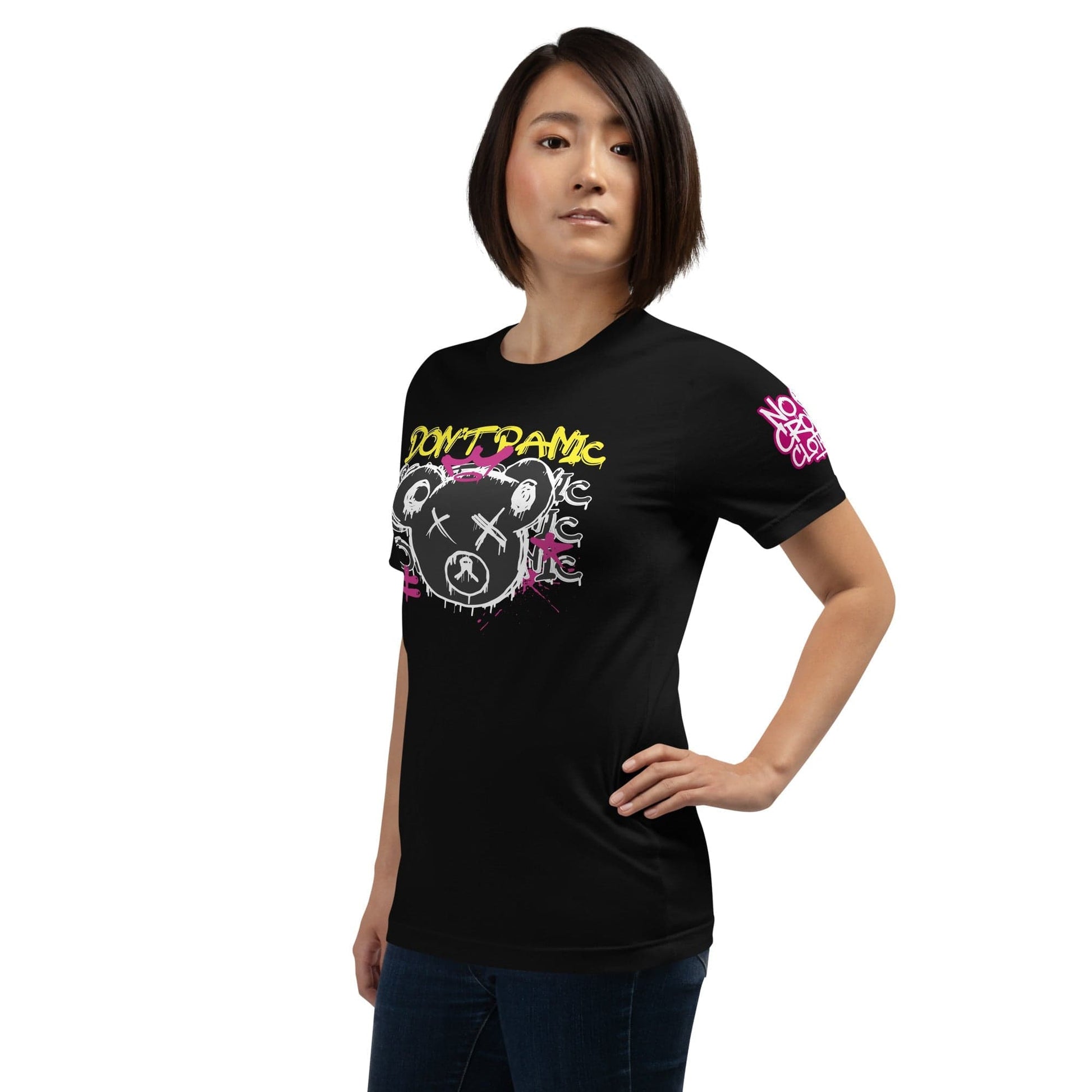 Comfortable 'Don't Panic' t-shirt with a playful design and calming message. Perfect for easing social anxiety, it encourages you to smile, breathe, and face the day with confidence, knowing everything will be okay...left.