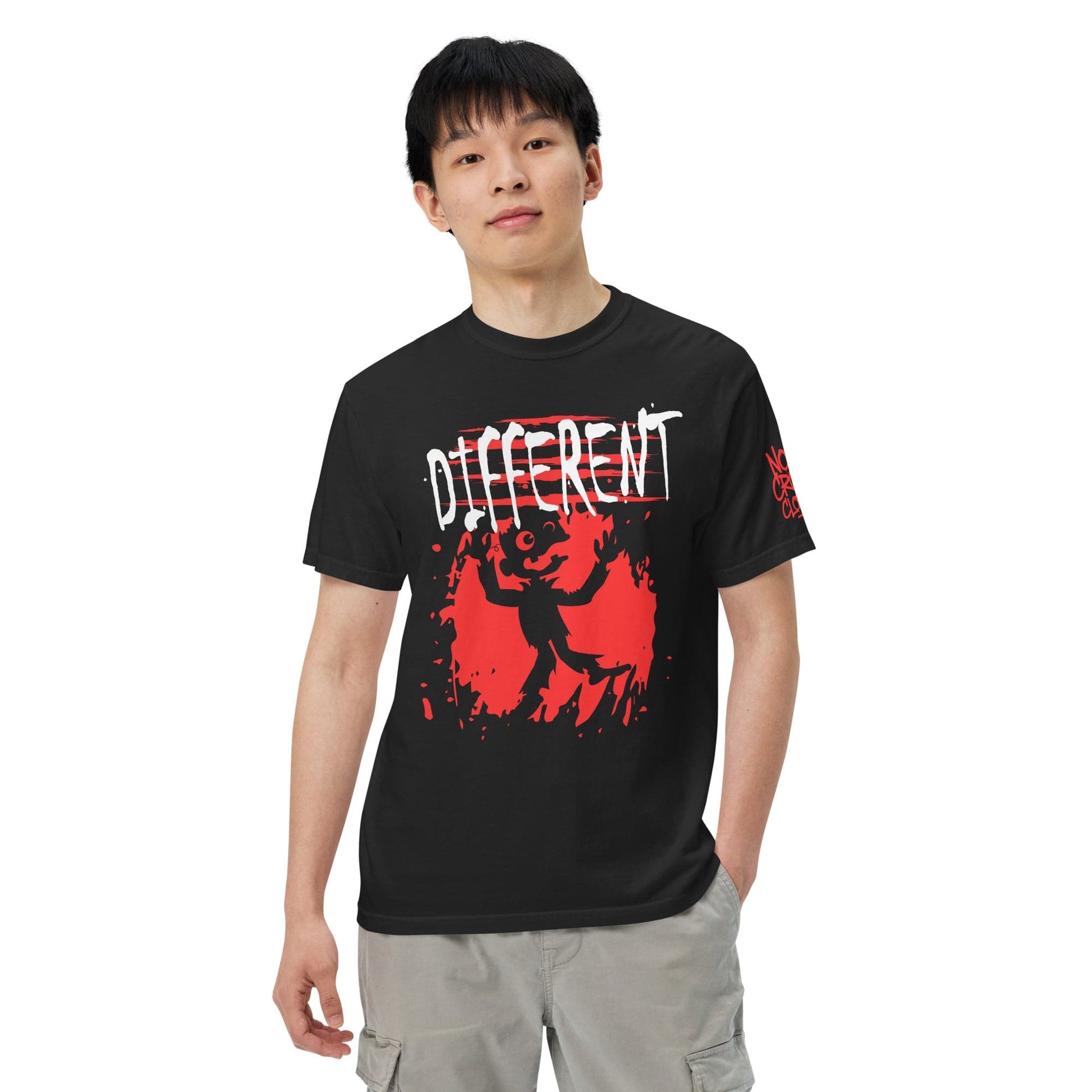 Black graphic t-shirt featuring the word “Different” in a bold, distressed design, representing individuality, self-acceptance, and nonconformity....front model