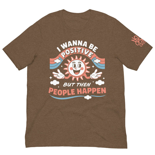 Brown t-shirt with a retro smiling sun design and the funny phrase “I Wanna Be Positive But Then People Happen,” featuring vintage-style colors and clouds.